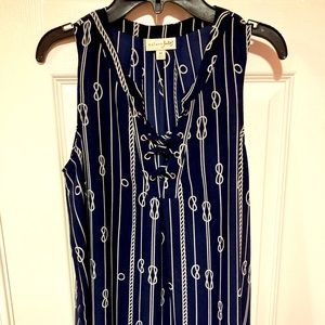 Sleeveless blue top with nautical knots